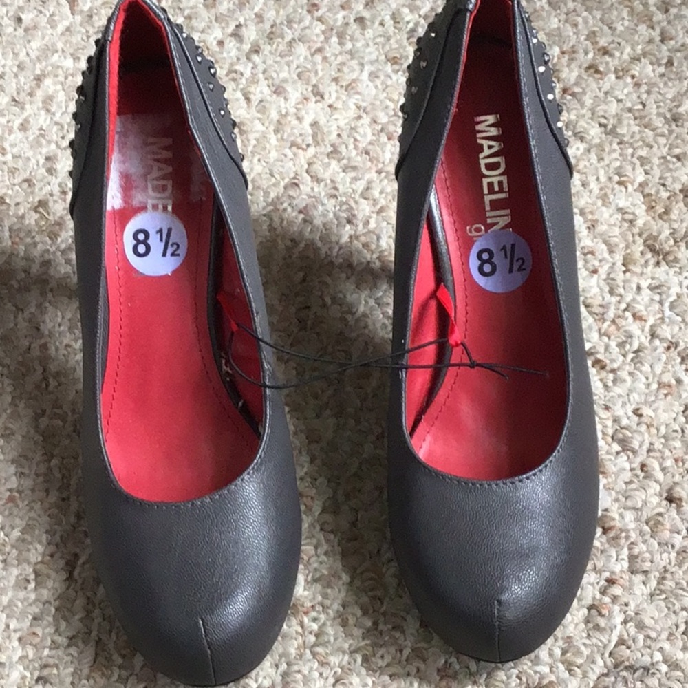 Woman’s grey high heel shoes